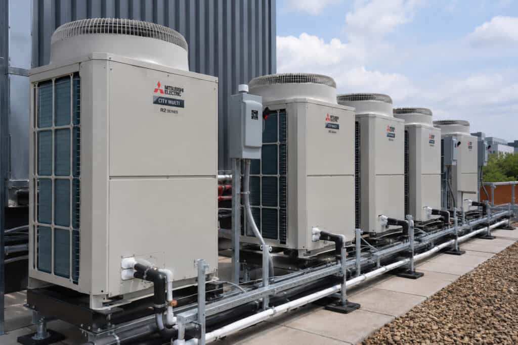 On roof commercial heat pump install using 5 Mitsubish units.